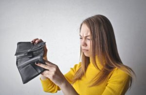 woman searching empty wallet